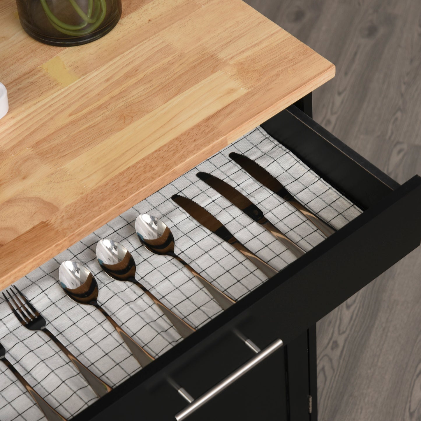 Shiny stainless steel cutlery set with black handles