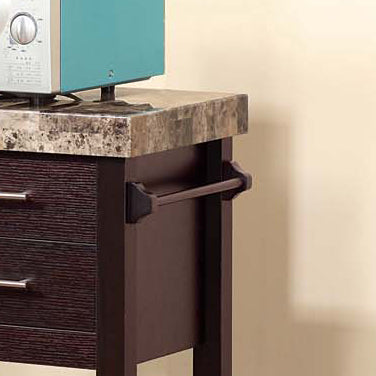 Compact stainless steel microwave oven on a faux marble countertop