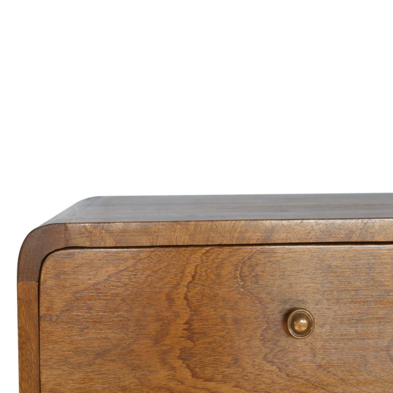 Closeup of a midcentury modern wooden dresser drawer with brass knob
