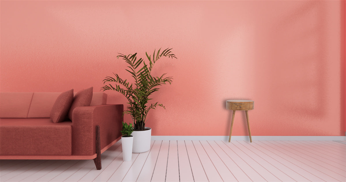 Coral textured wall paint provides a warm inviting backdrop for a modern living room setup