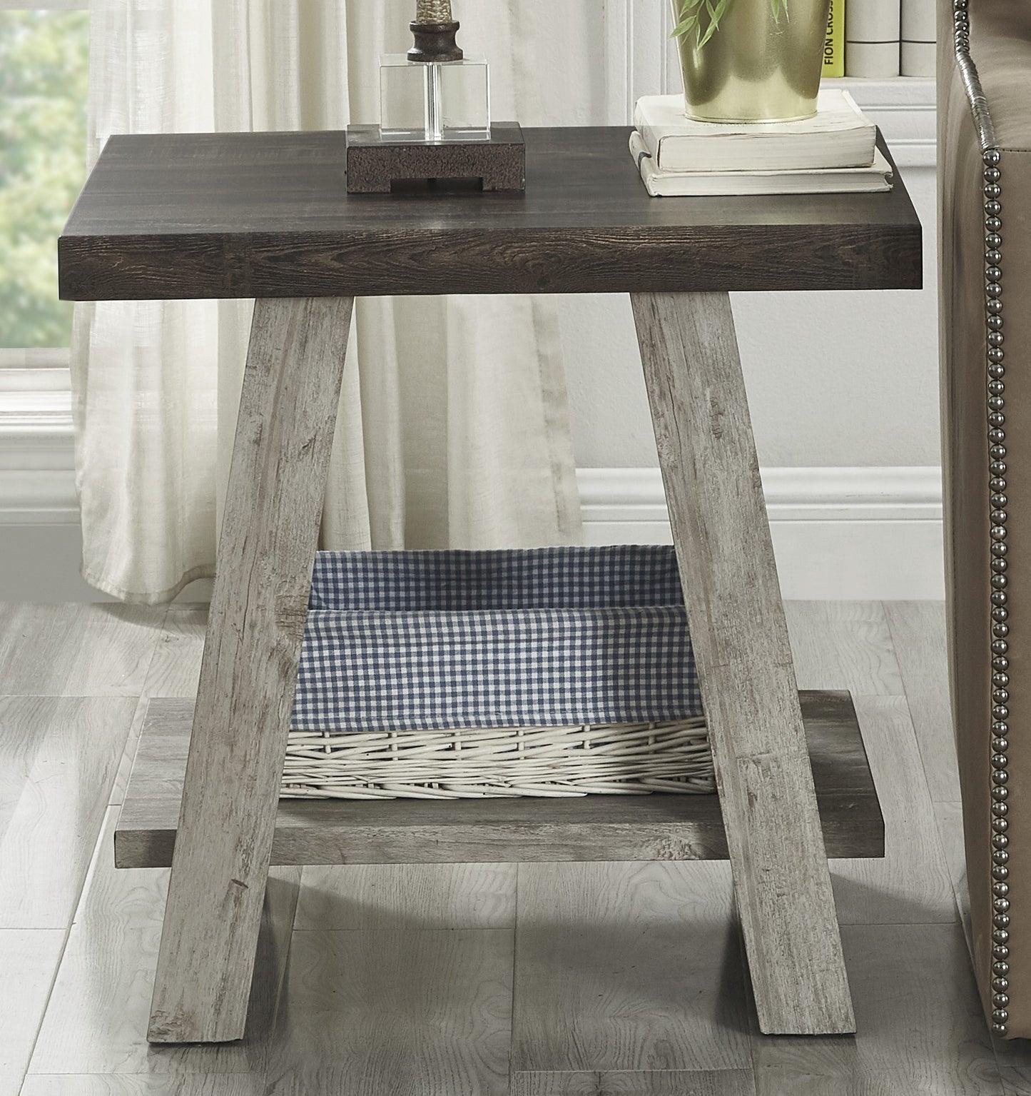 Rustic dark wood side table with a woven basket and checkered liner