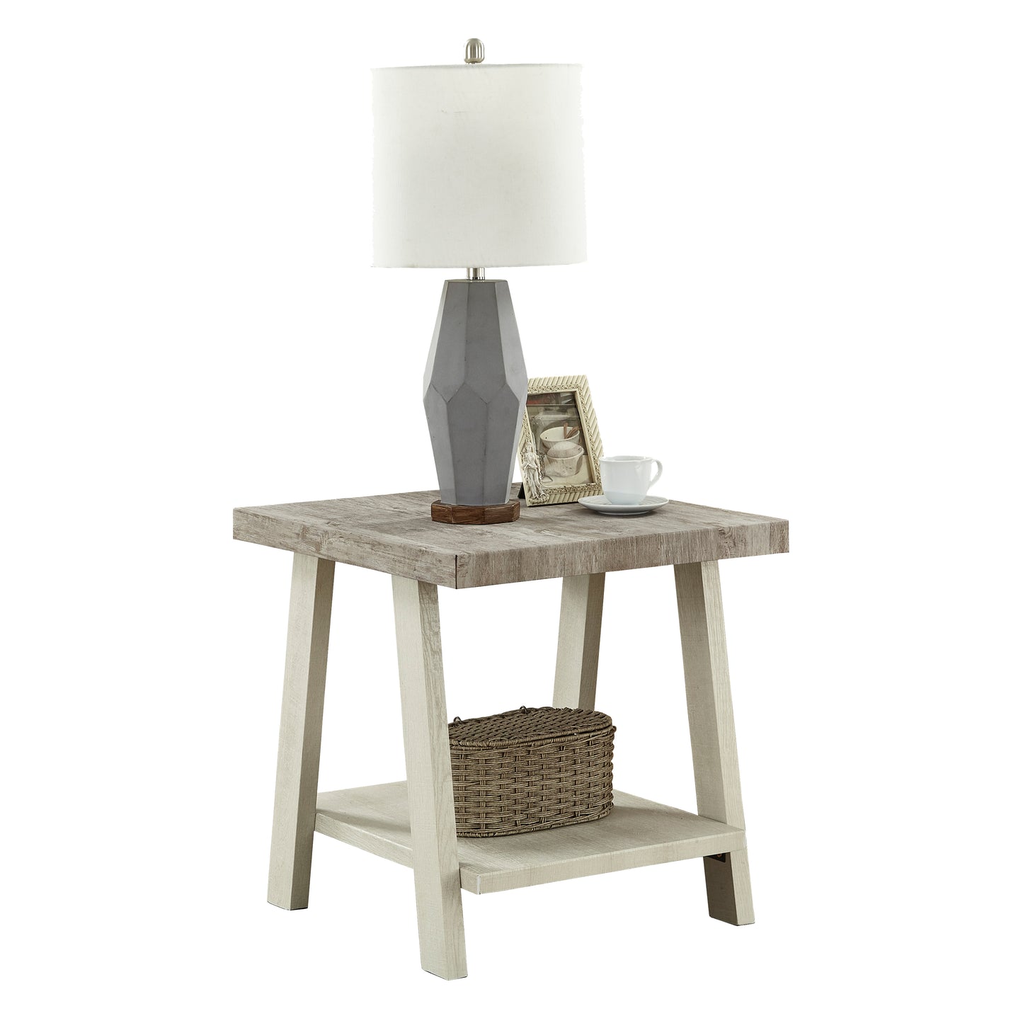 Distressed wood end table with geometric gray lamp framed picture and white mug