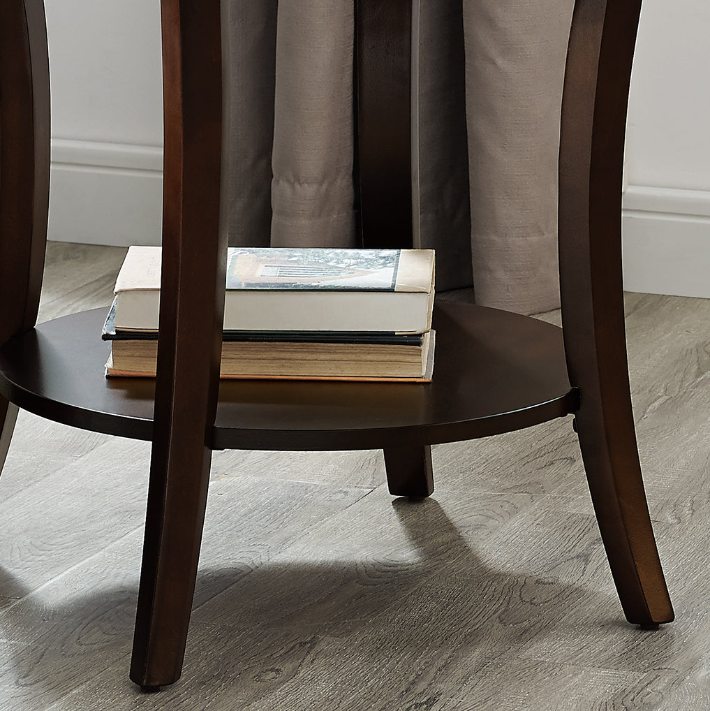 Dark brown wooden side table with a stack of three books on its lower shelf