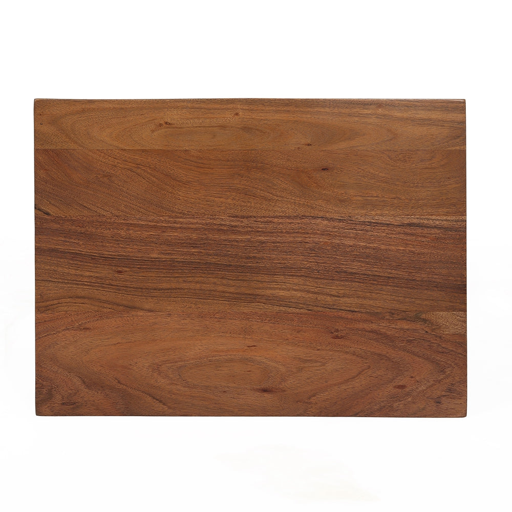 Closeup of a natural acacia wood cutting board with prominent grain patterns