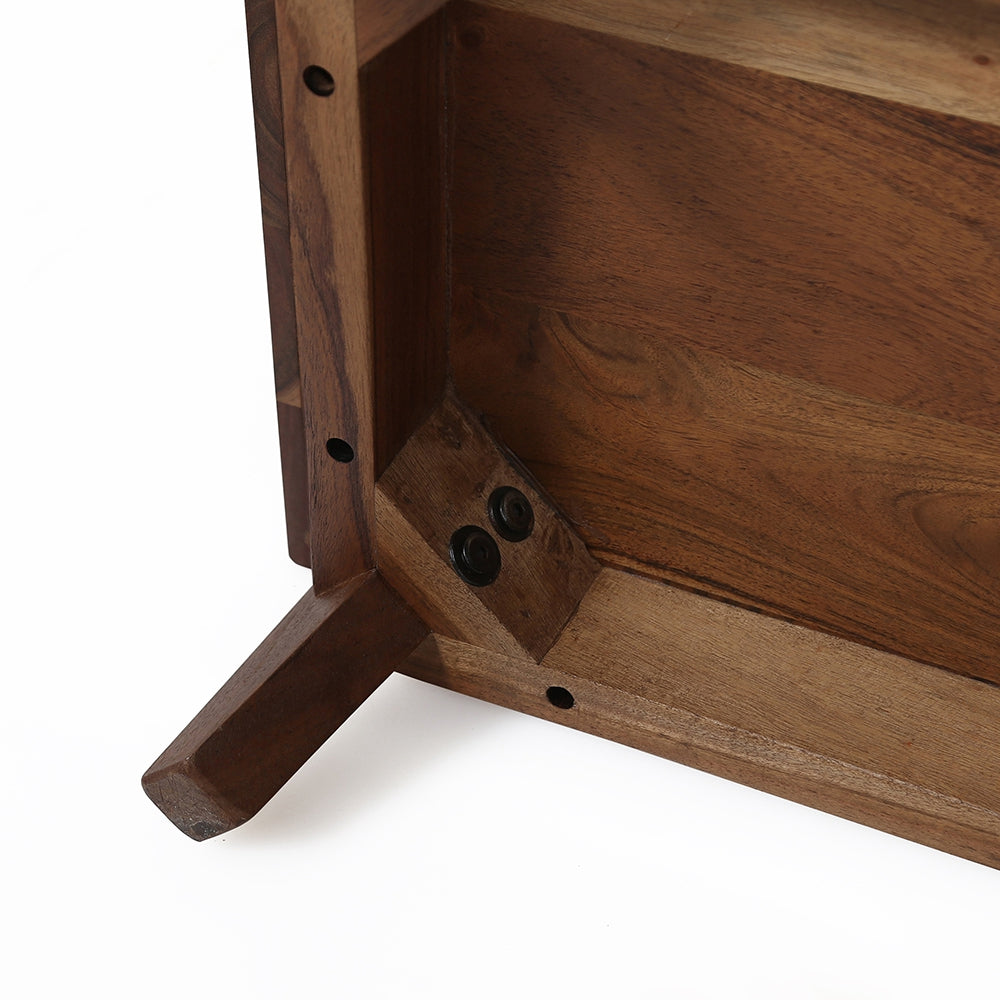 Closeup of solid wood table leg and joinery on dark walnut finish