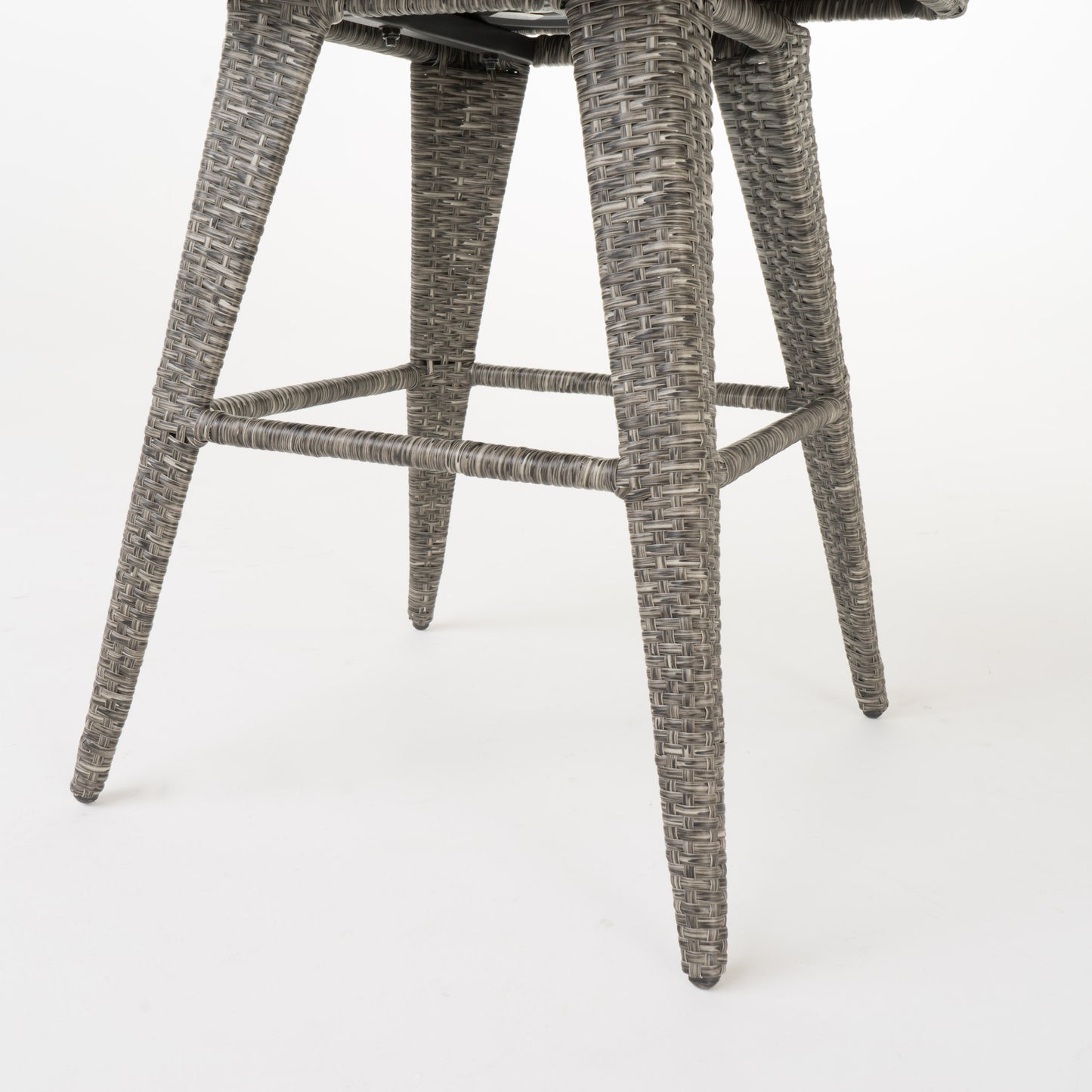 Gray wicker bar stool legs with woven texture