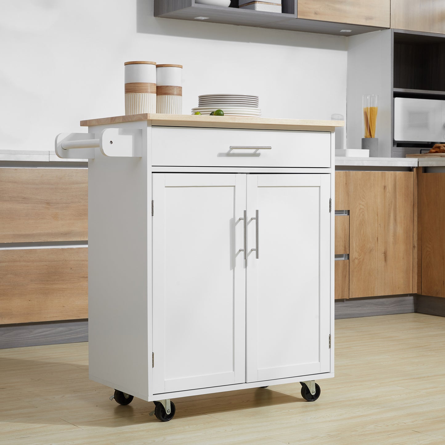 White kitchen island with wooden top and chrome handles
