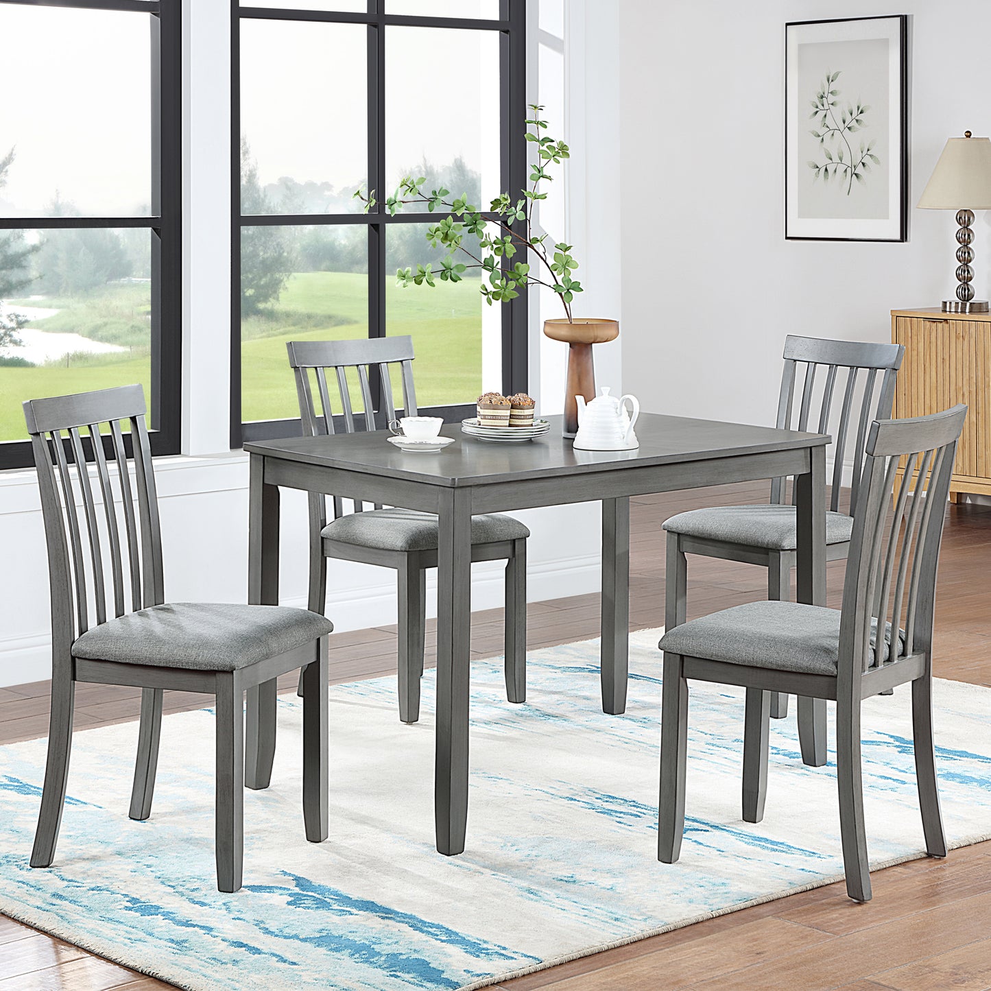 Grey dining set with square table and four slatted back chairs