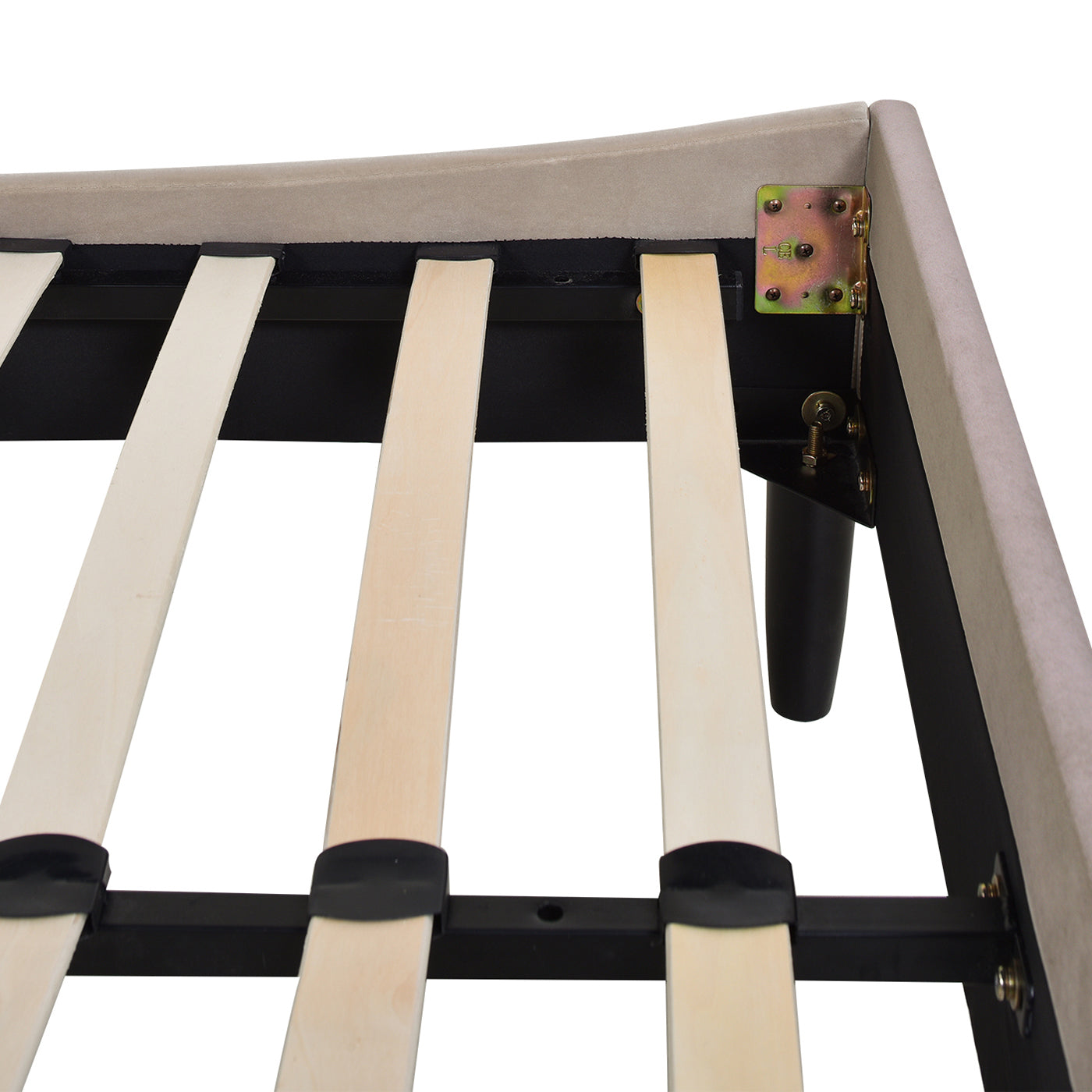Closeup of beige upholstered bed frame with wooden slats and black legs