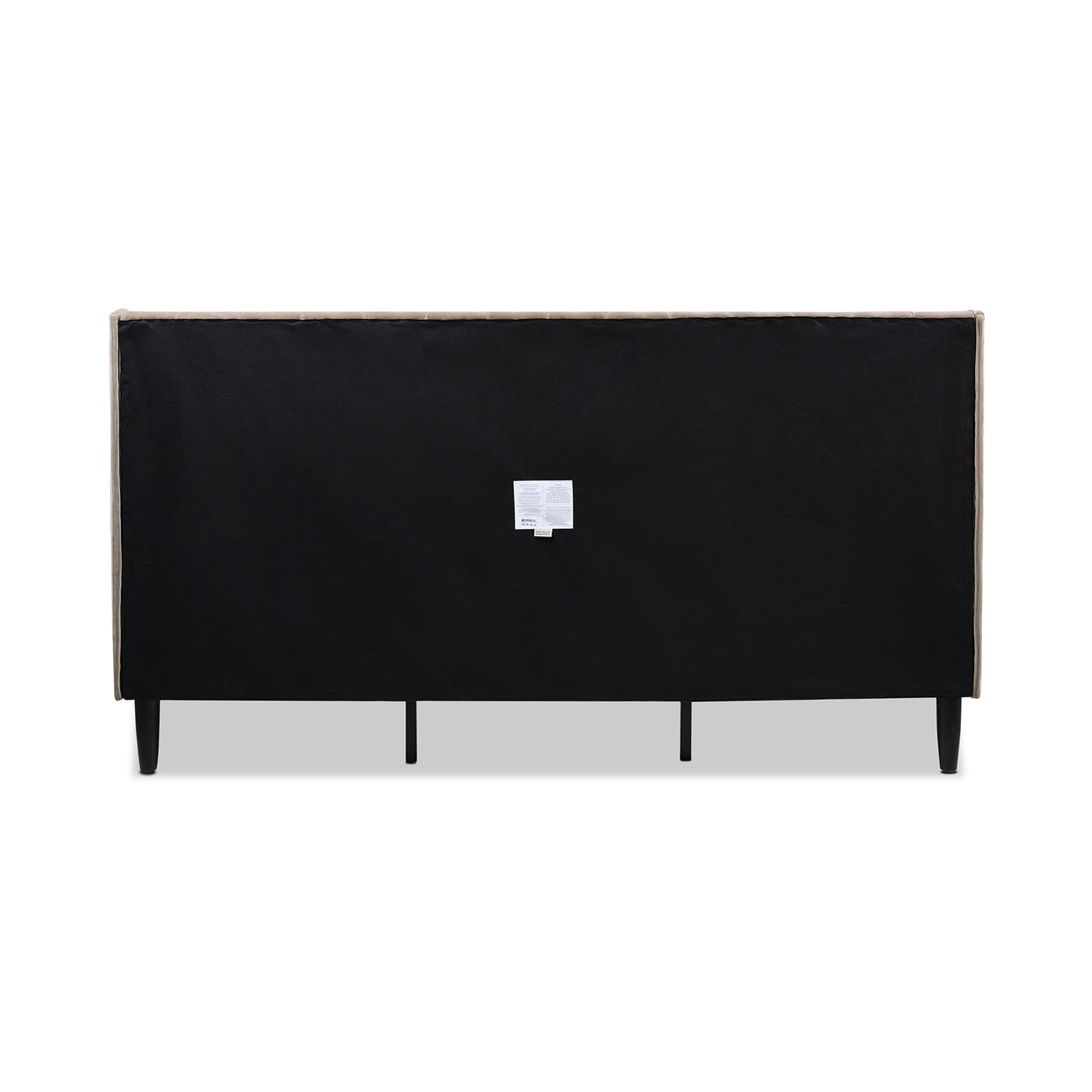 Back view of a beige upholstered headboard with black legs and fabric backing