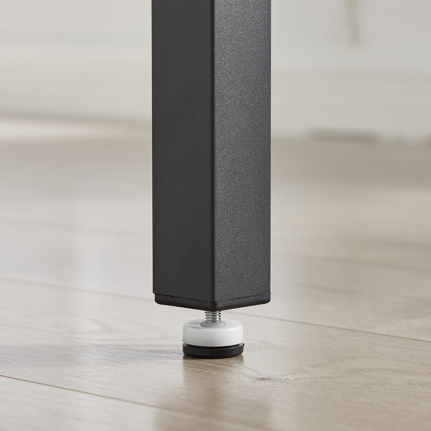 Black metal table leg with adjustable foot leveler