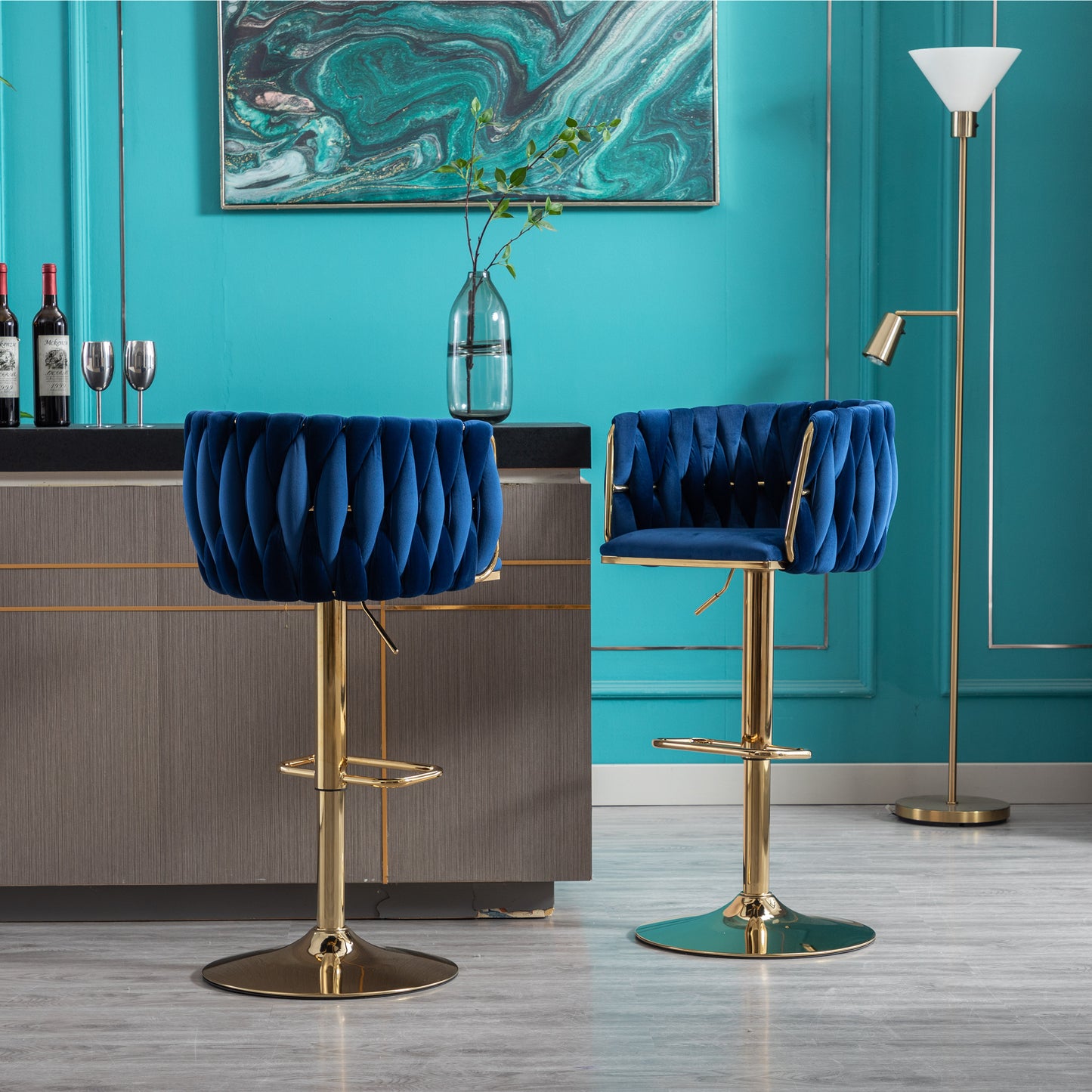 Luxurious blue velvet bar stool with gold accents and adjustable height