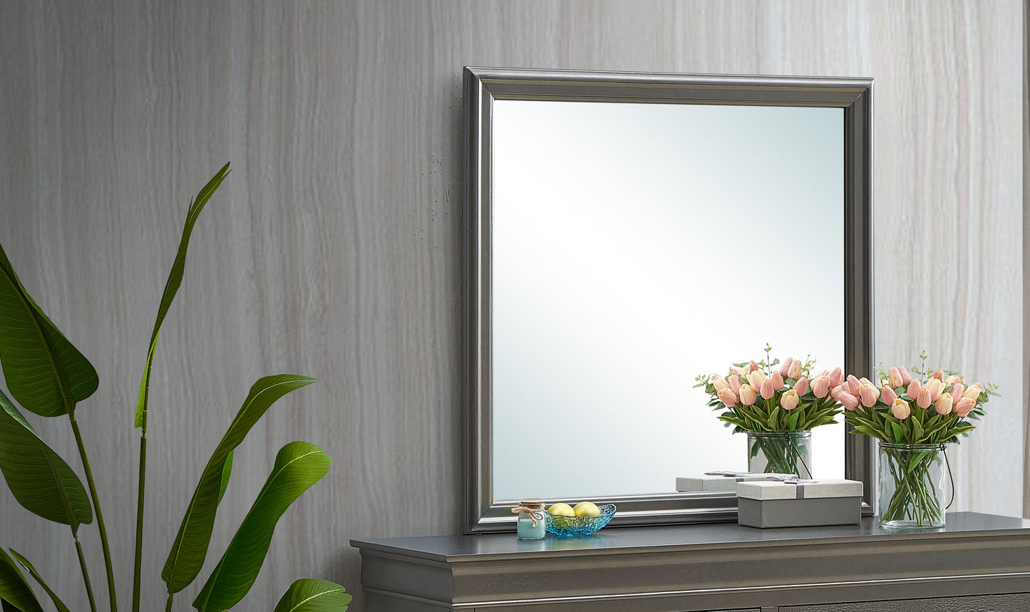 Silver framed wall mirror with decorative accents