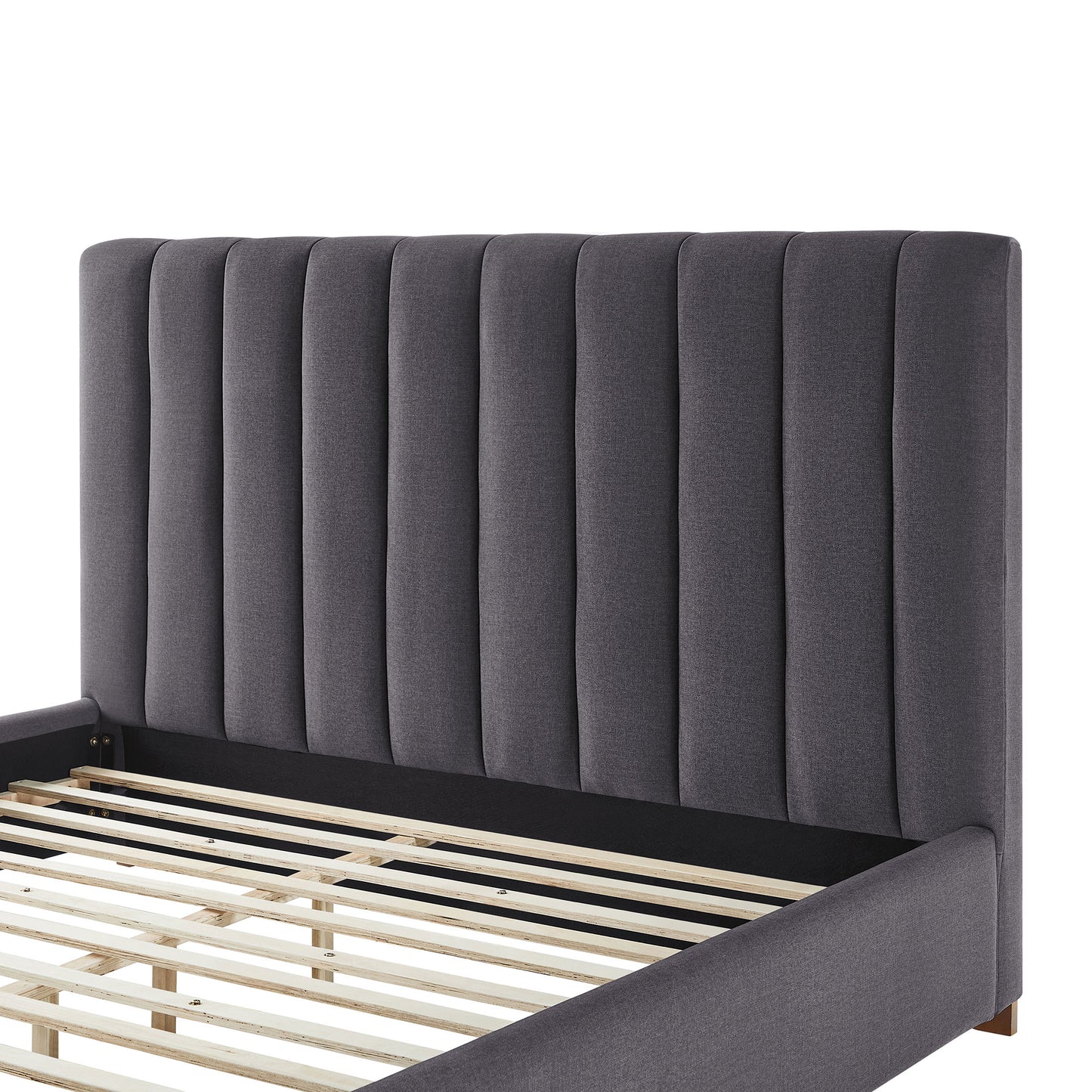 Dark gray fabric upholstered platform bed frame with vertical channel tufting on headboard