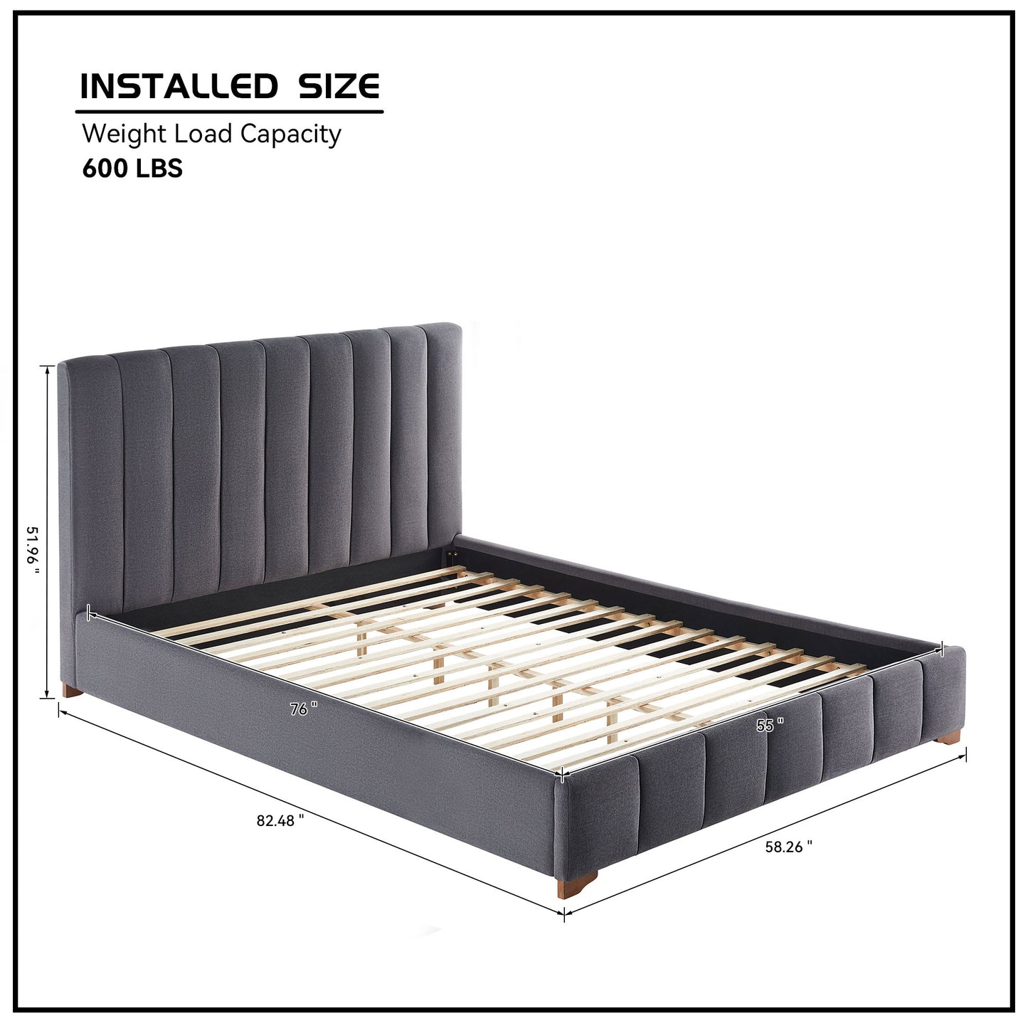 Platform bed with upholstered grey fabric and vertical channel tufting on headboard