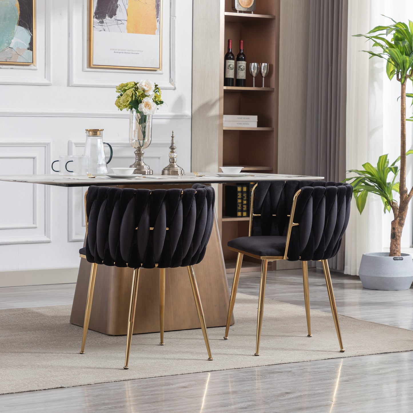 Black velvet accent chair with pleated design and gold legs