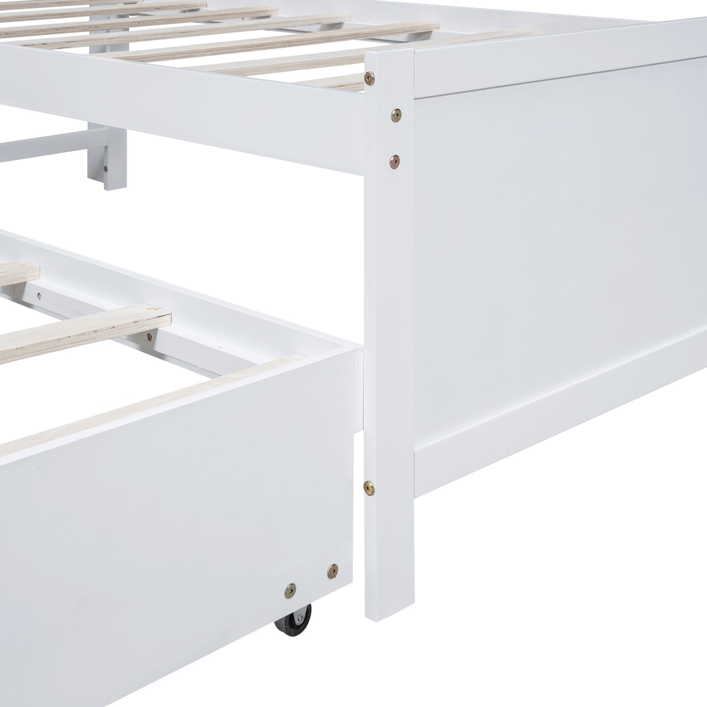 Closeup of white twin bed frame with wooden slats and a rollout drawer on wheels