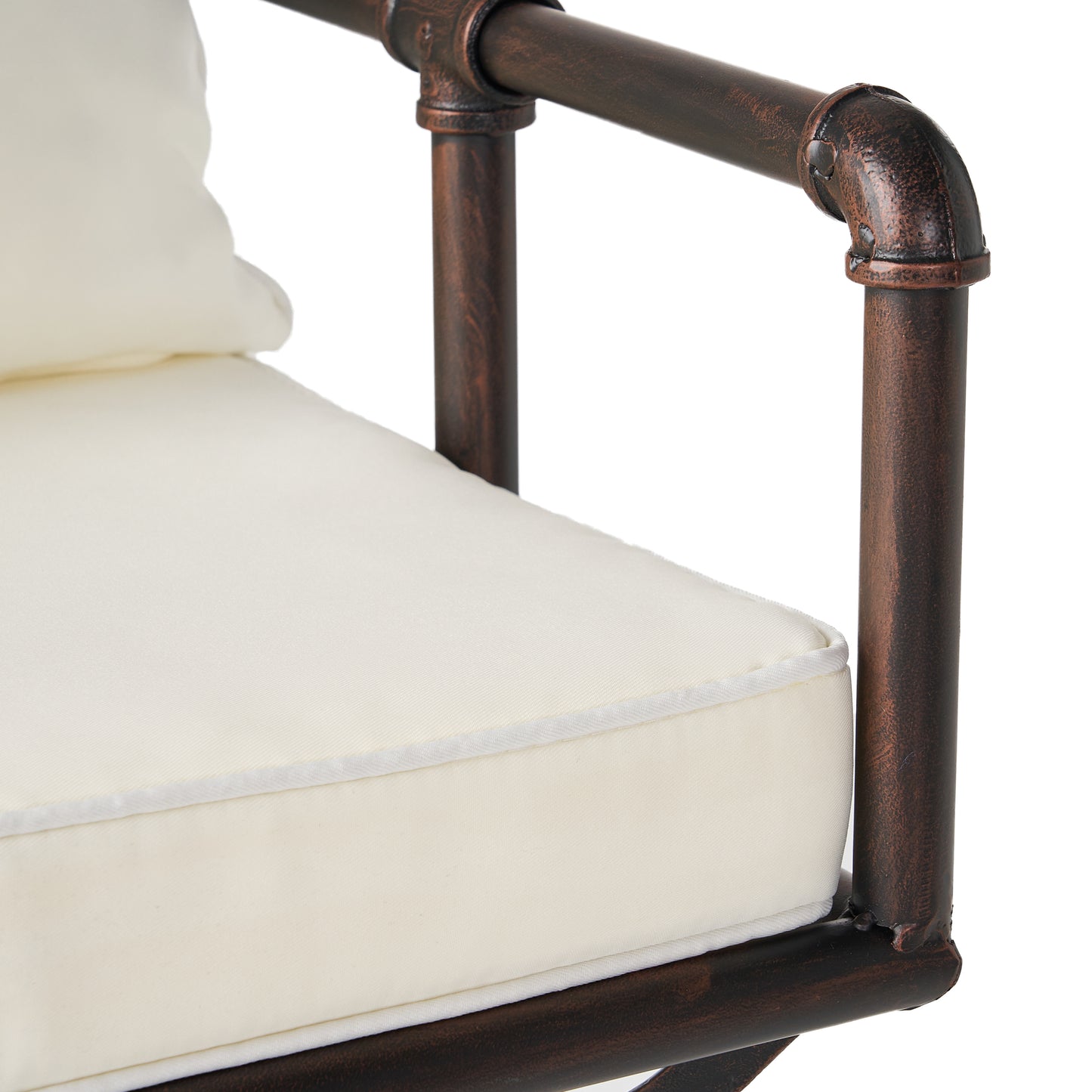 Cream cushioned chair with industrial pipe frame
