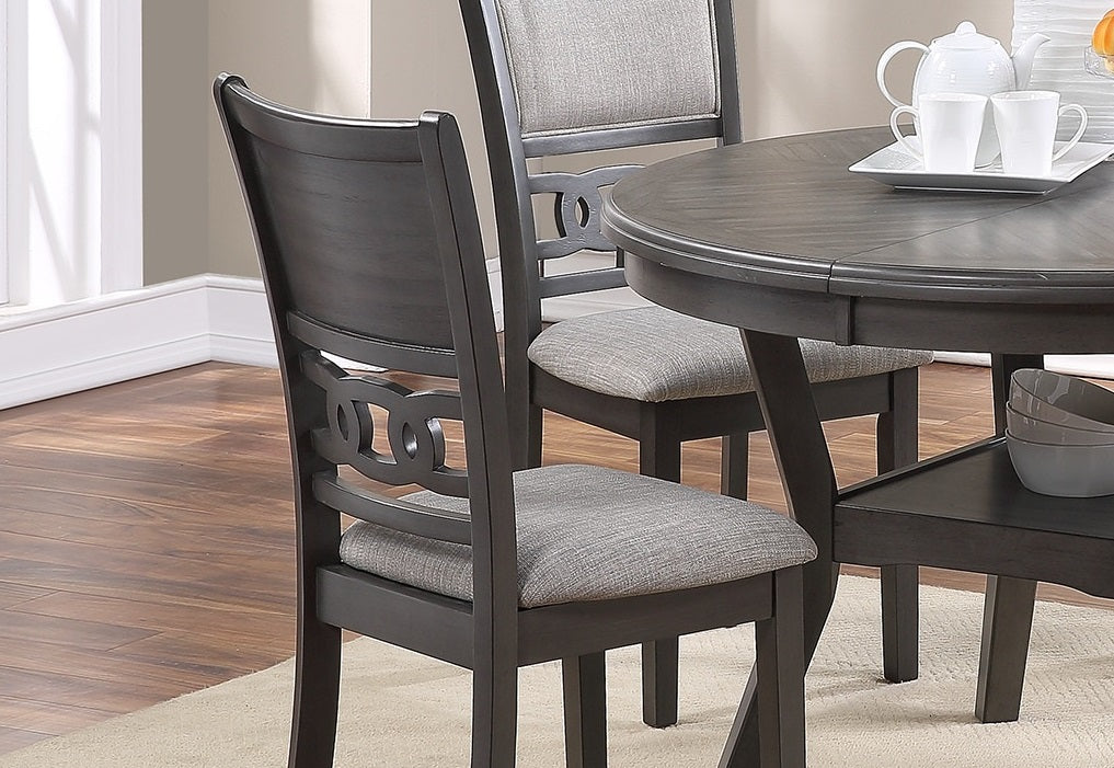 Dark grey dining chair with upholstered grey seat and decorative back