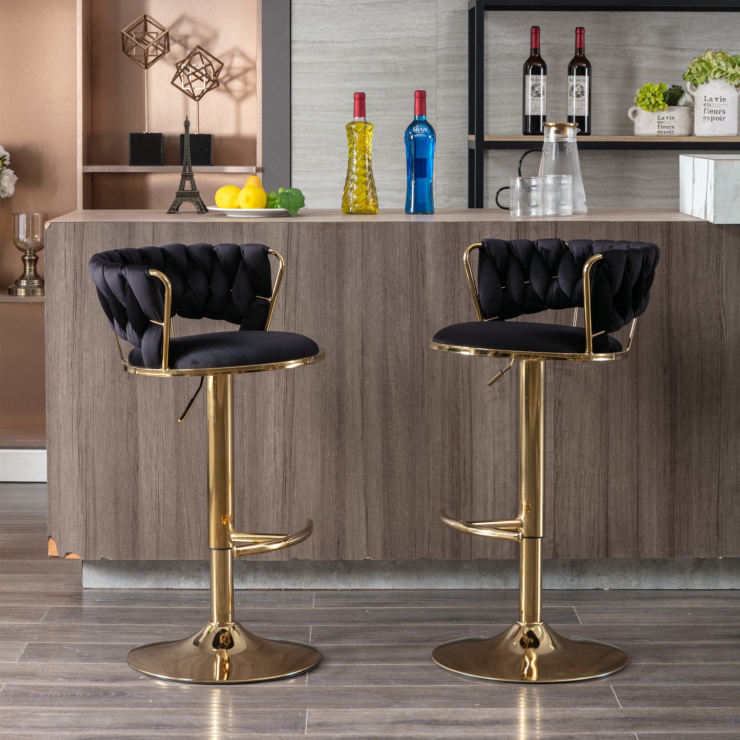 Black velvet bar stool with tufted back and gold pedestal base