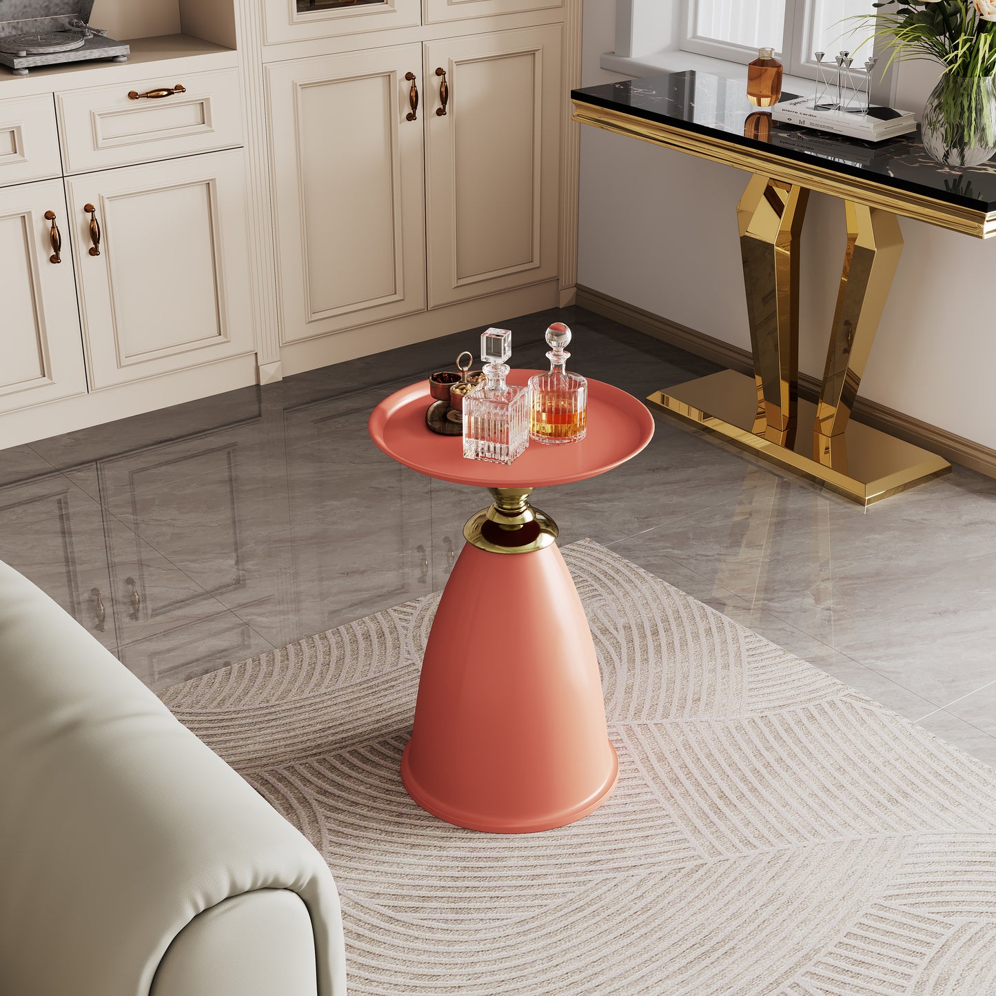 Coral accent table with gold base and decorative items