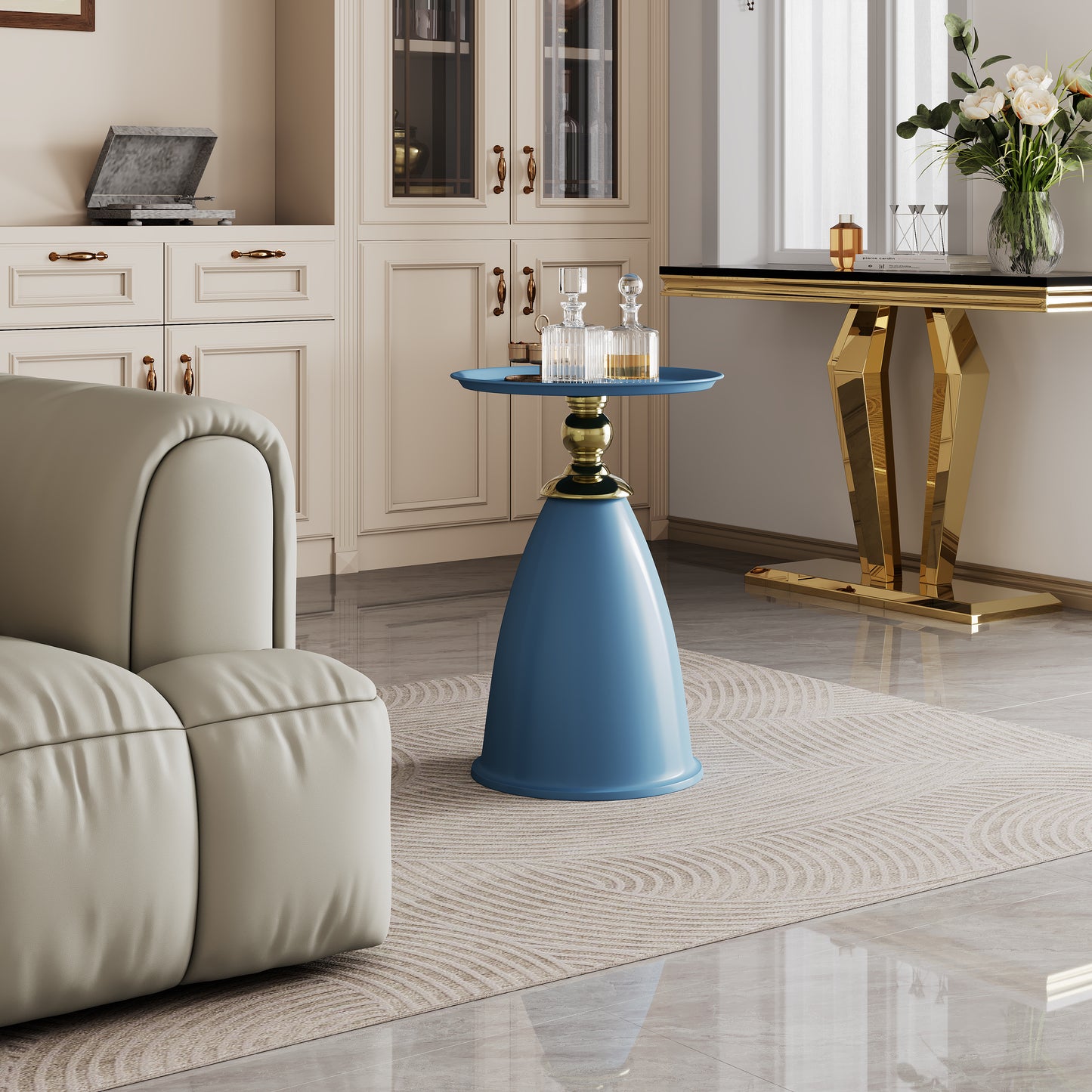 Blue sculptural side table with gold accents and glass decanters