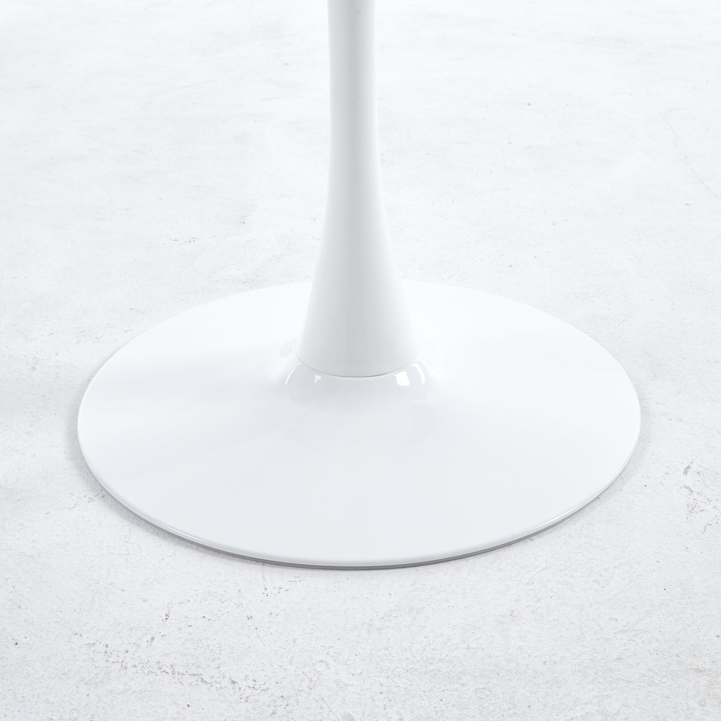 White round pedestal base for a modern dining table