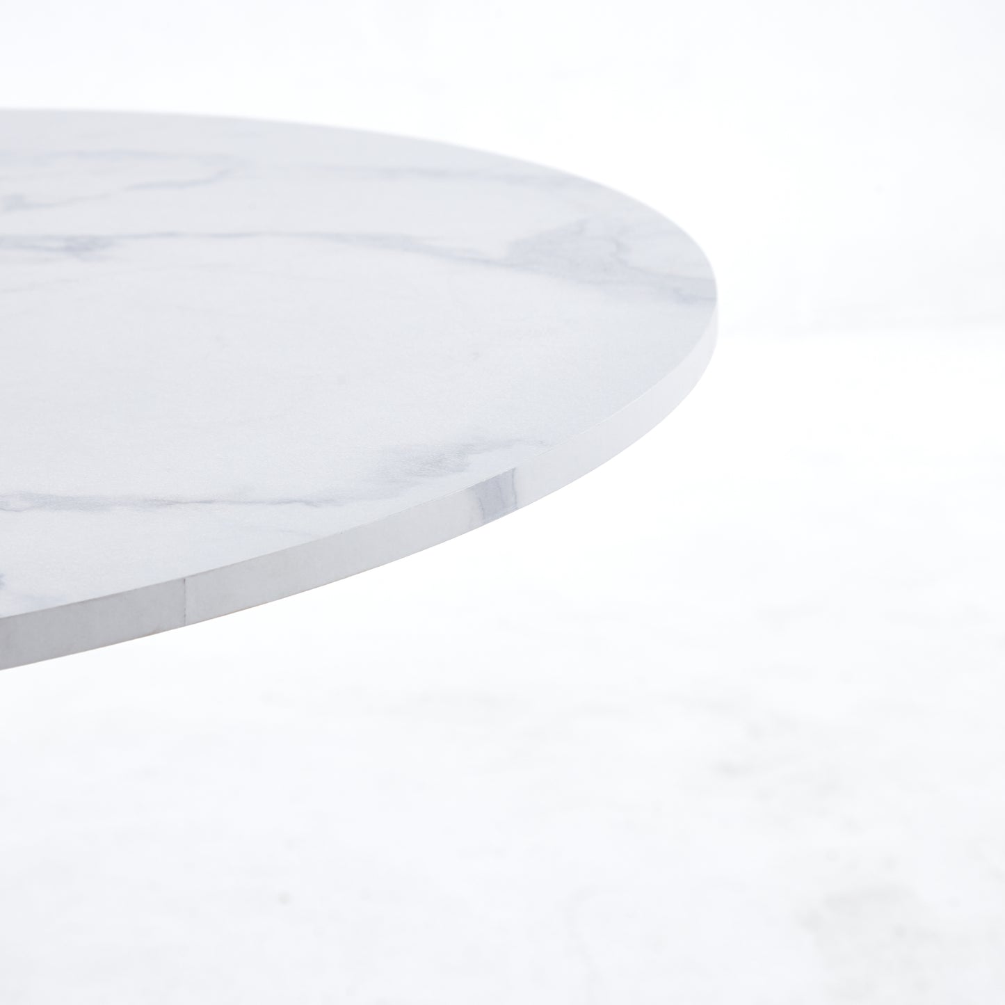 Round marble coffee table top with white and grey veining detail