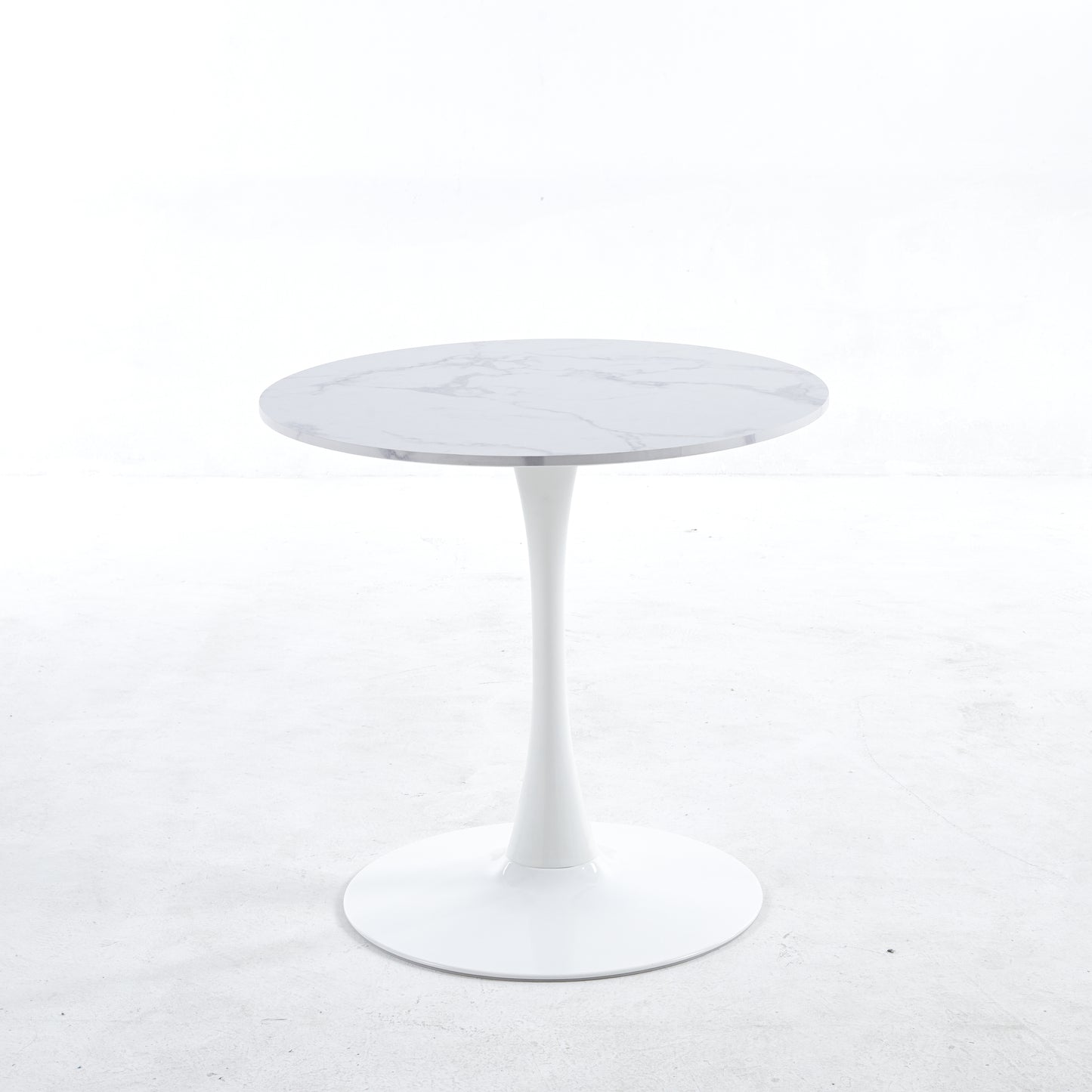 White marble top tulip table with a sleek modern white pedestal base perfect for dining rooms