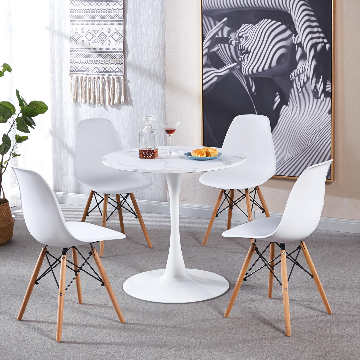 Set of four white tulip chairs with natural wood legs perfect for dining spaces