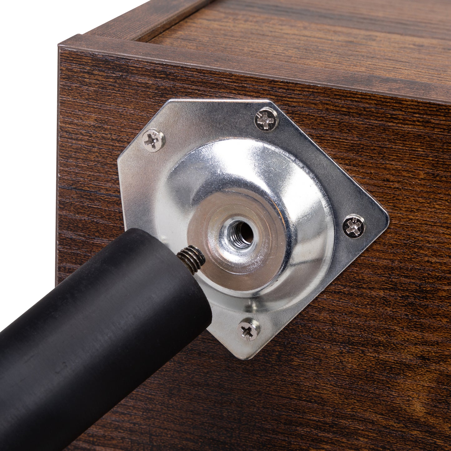 Dark wood dresser base with a detached black furniture leg and silver mounting plate