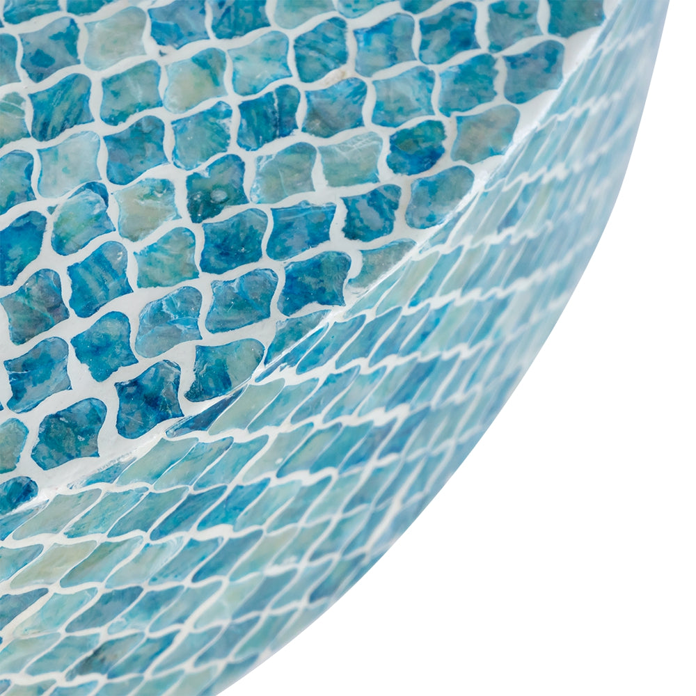 Textured blue mosaic bowl with iridescent shimmer adds coastal elegance