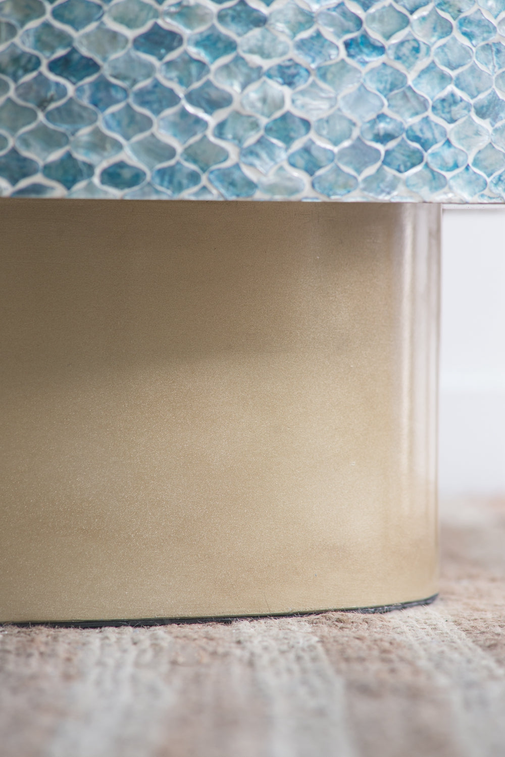 Beige cylindrical base with a textured blue mosaic lantern shade