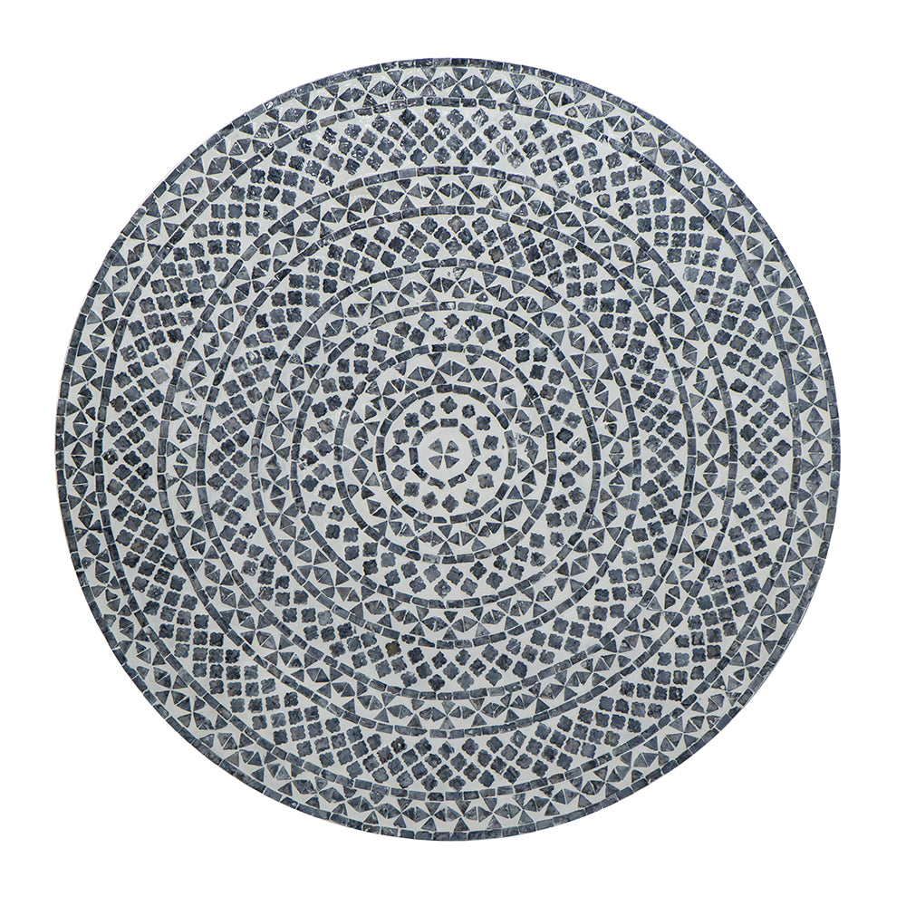 Round mosaic table top with concentric geometric patterns in white and dark grey