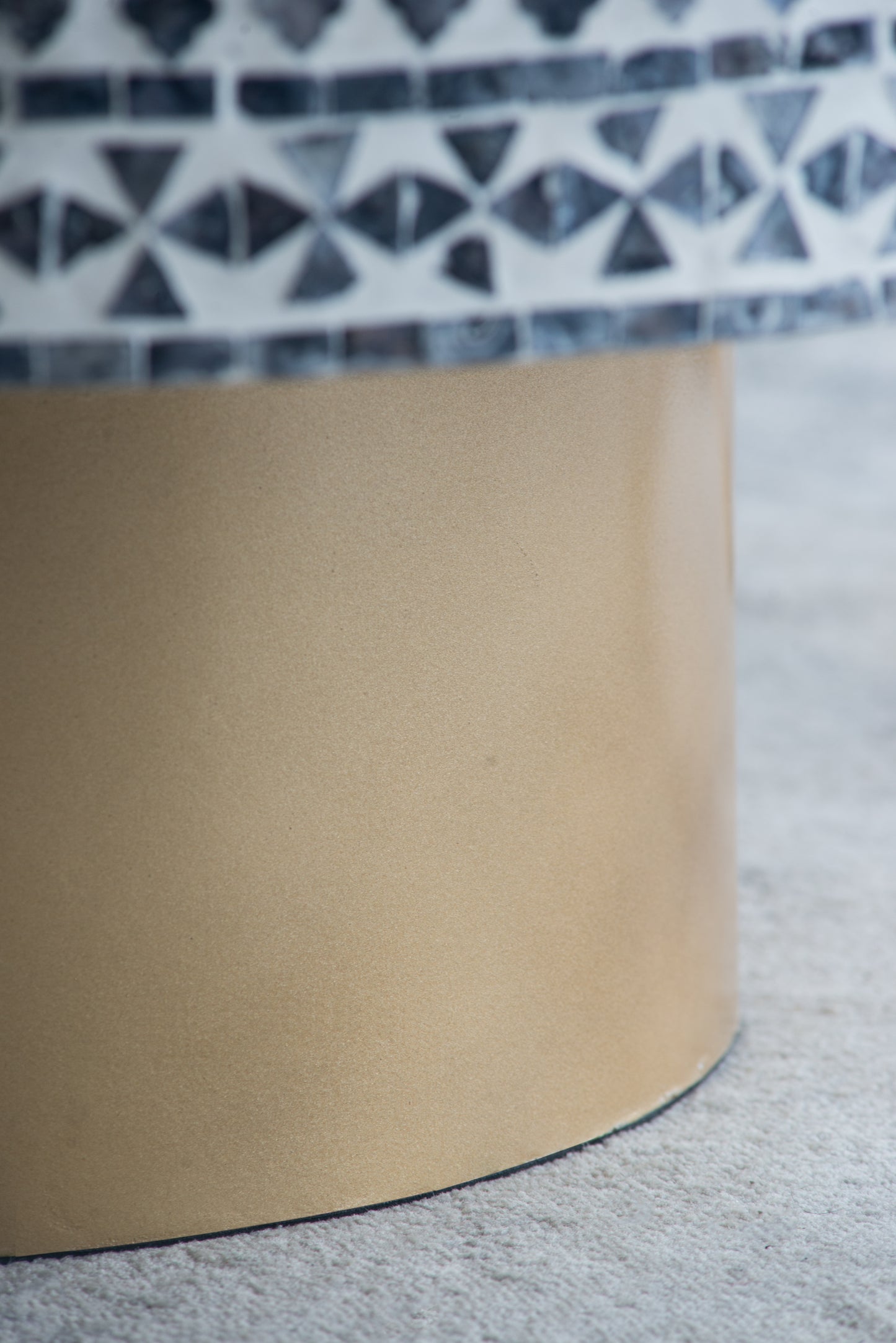 Golden ceramic vase with a mosaic border featuring blue geometric patterns ideal for modern decor