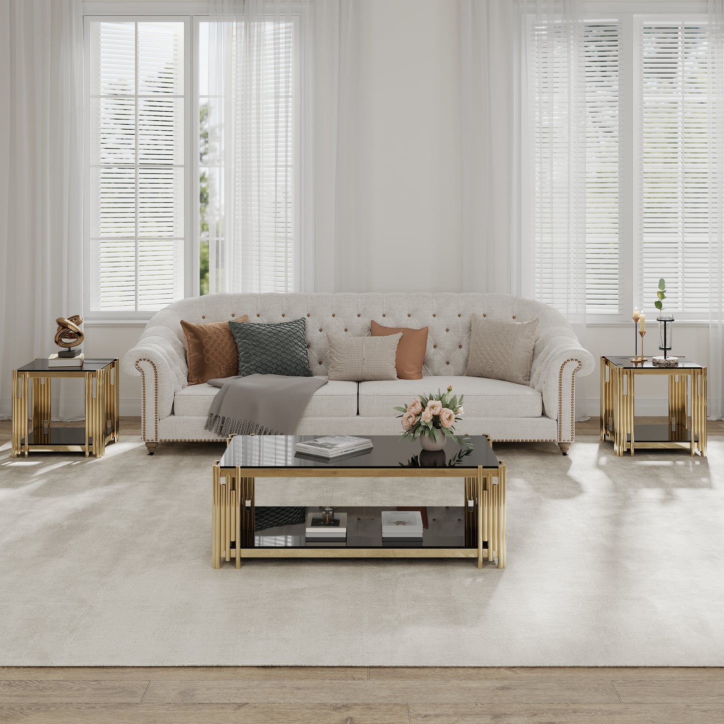 Elegant tufted white sofa with gold accent nailhead trim adorned with plush throw pillows