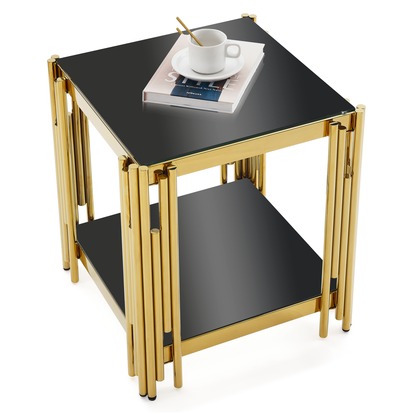 Gold and black glass side table with contemporary flair and a magazine on top