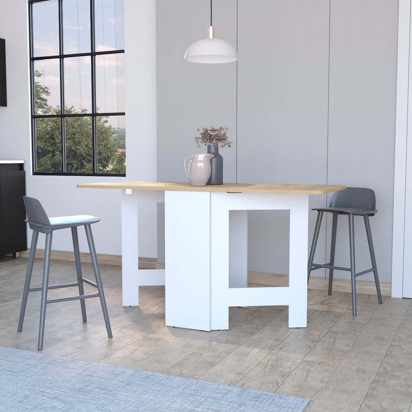 Compact drop leaf dining table with light wood top and white base seats two