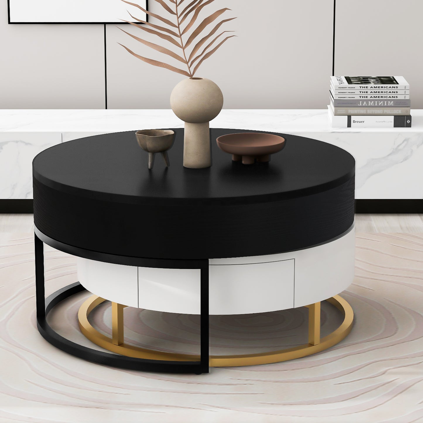 Modern round coffee table with black and white finish featuring gold accents