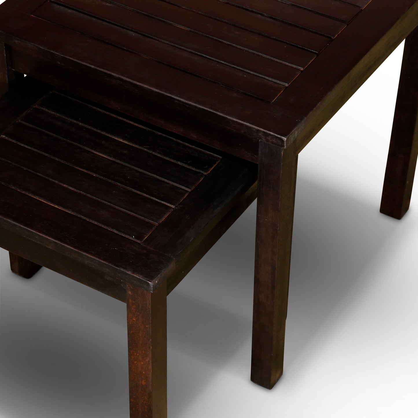 Dark wood nesting tables with slatted tops for versatile living room storage
