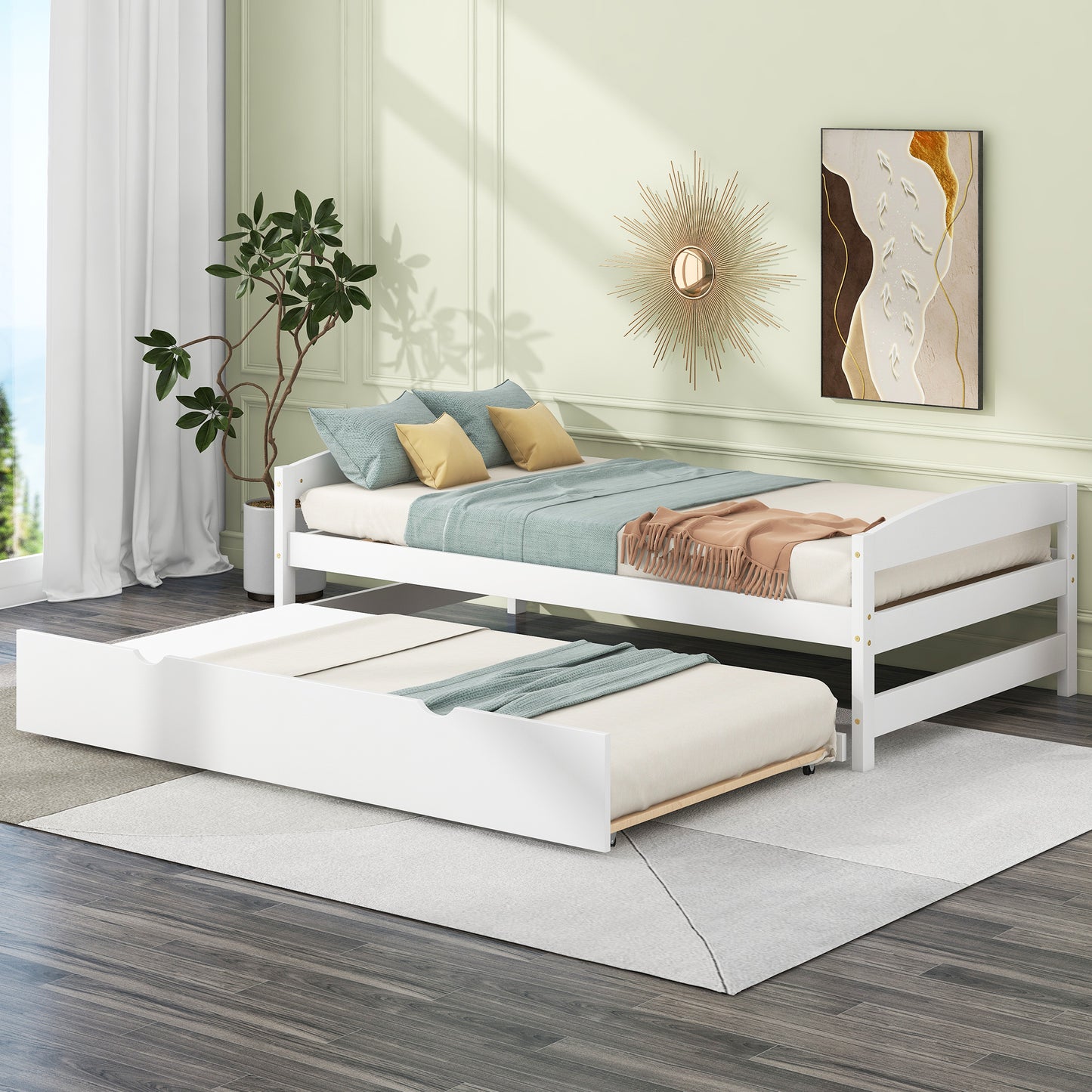 White twin daybed with pullout trundle and blueyellow bedding