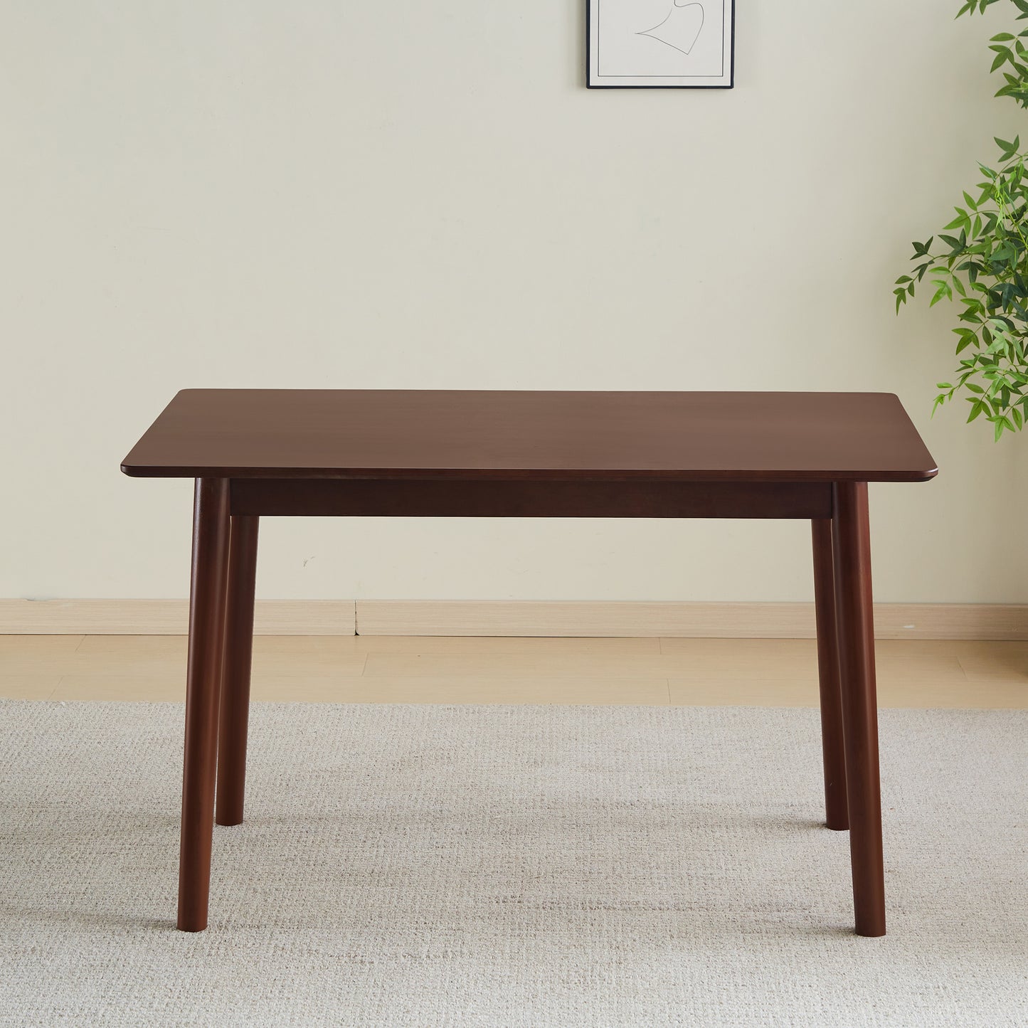Dark wood dining table with tapered legs