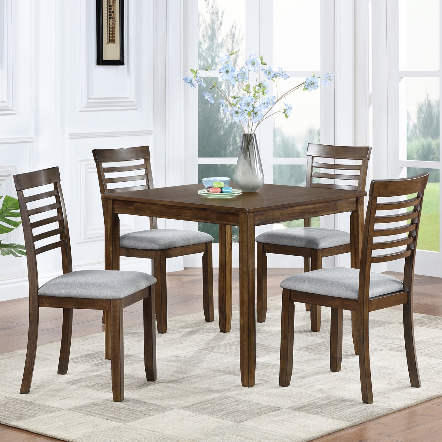 Square dining table with ladder back chairs in dark wood finish and grey seats