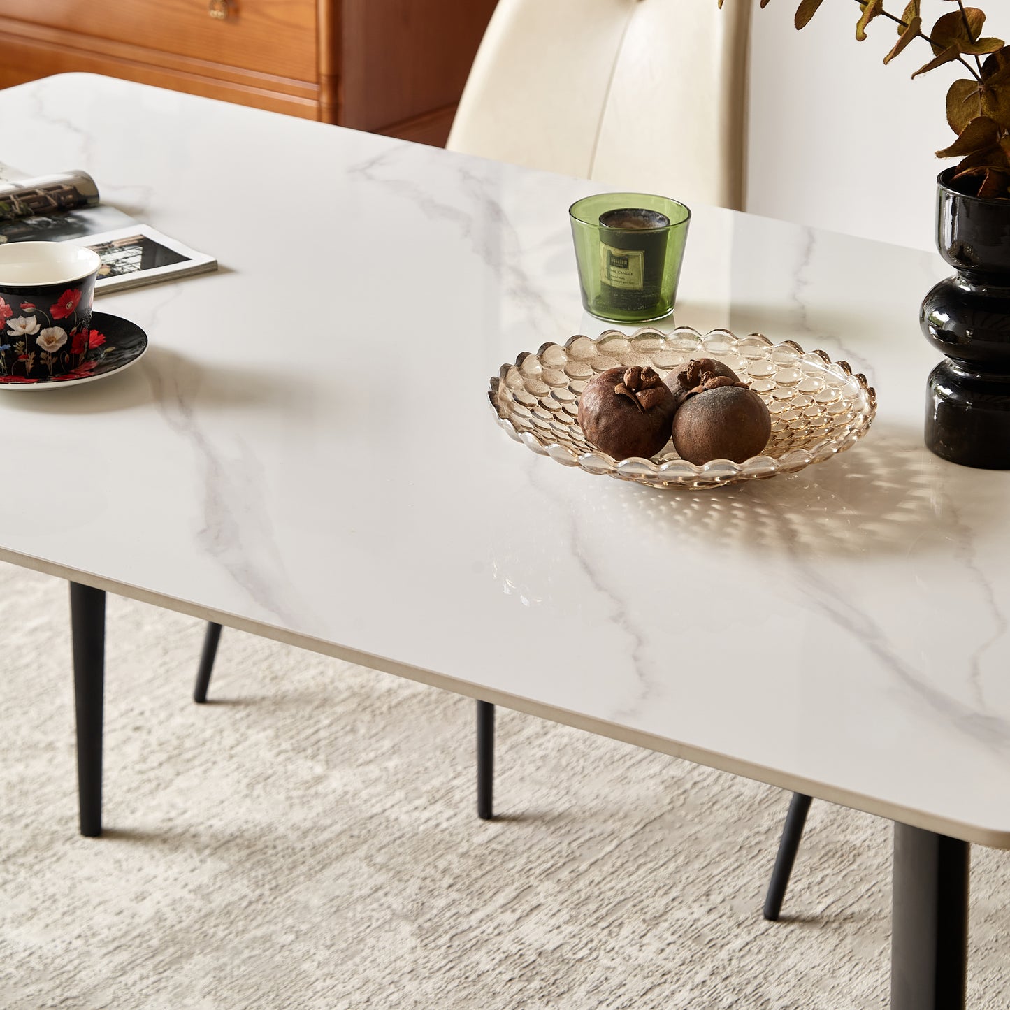 Elegant white marble top dining table with black metal legs