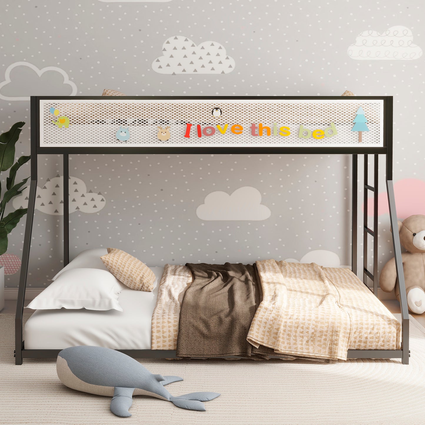 Black metal bunk bed with white bedding and patterned throw blankets