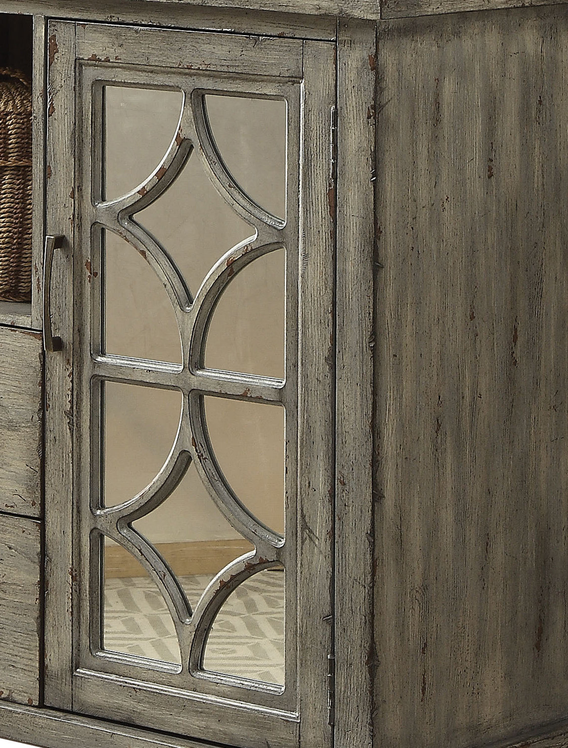 Distressed gray wood cabinet with decorative mirrored glass door panel