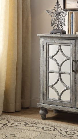 Grey distressed wood cabinet with mirrored diamond pane doors