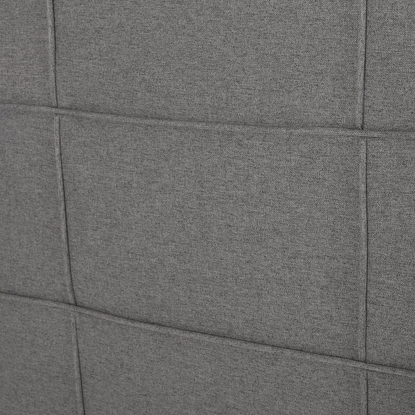 Closeup of quilted charcoal gray fabric texture