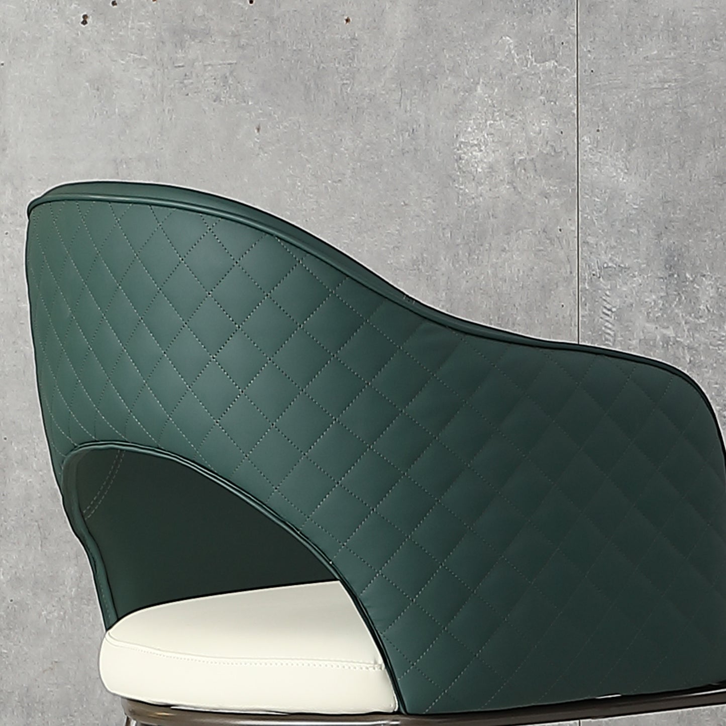 Emerald green quilted leather accent chair with white cushion