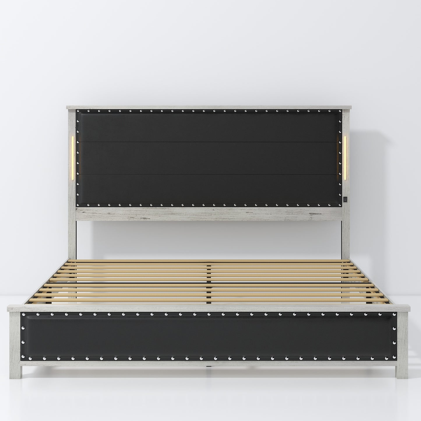 Gray wood platform bed with black upholstered headboard featuring metal studs and LED lighting